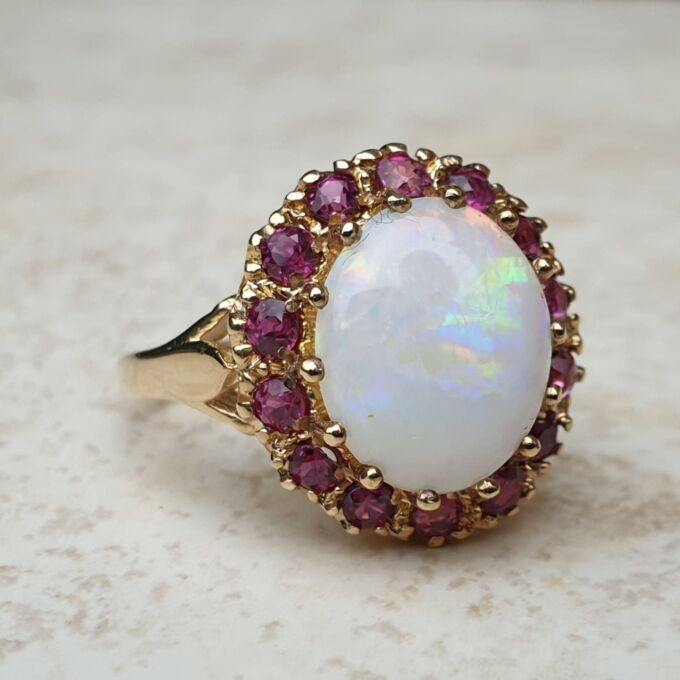Opal & Ruby Ring in 9ct Gold, a UK O or a US 7 1/2