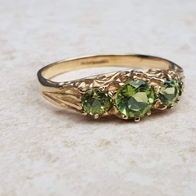Summery Peridot Three Stone Ring in 9ct Gold, a UK N 1/2 or a US 7 1/4.