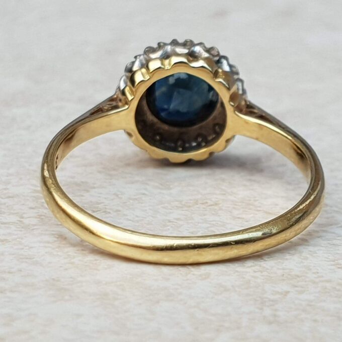 Sapphire and Diamond Halo ring in 18ct Gold and Platinum, a UK M or a US 6 1/2.