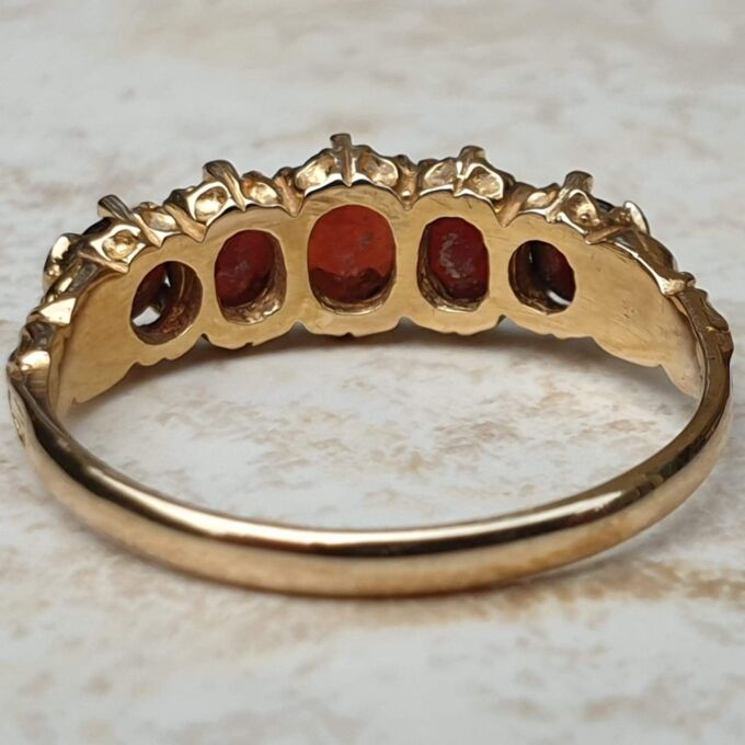 Five Stone Graduating Ring in 9ct Gold,  a UK R or a US 9.