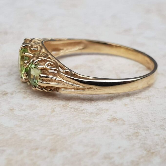Summery Peridot Three Stone Ring in 9ct Gold, a UK N 1/2 or a US 7 1/4.
