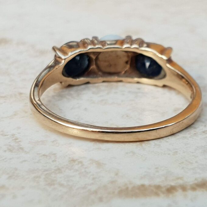Opal and Sapphire Trilogy Ring in 9ct Gold, a UK J 1/2 or a US 5 1/4.