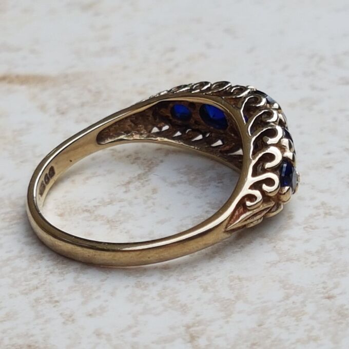 Vibrant Blue Five Stone Synthetic Sapphire Ring in 9ct Gold, a UK N or a US 7.
