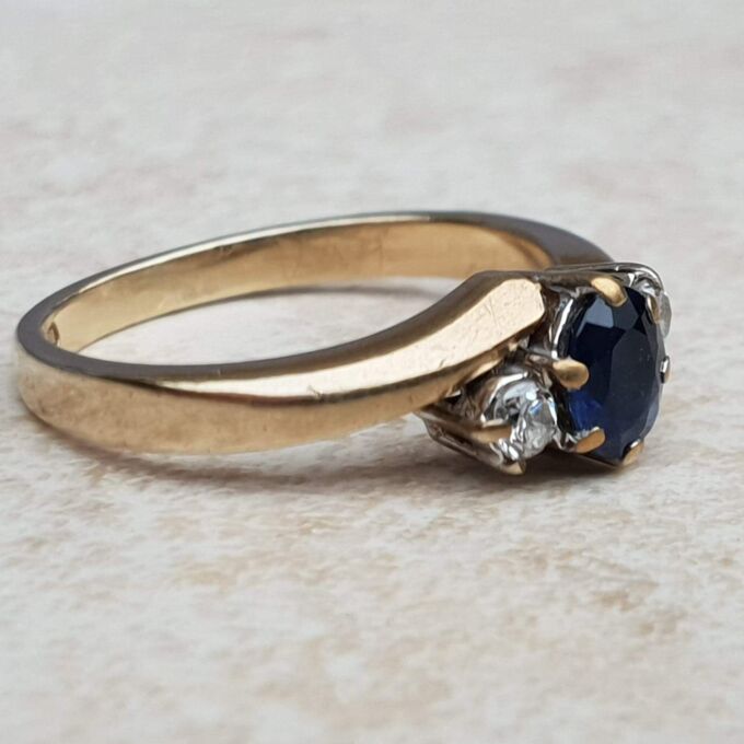 Sapphire and Diamond Trilogy Bypass Ring in 9ct Gold, a UK I 1/2 or a US 4 3/4.