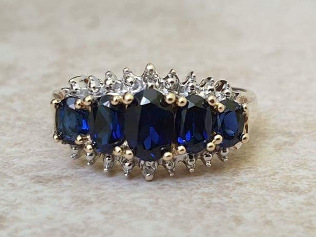 Graduating Synthetic Sapphire Five Stone Ring in 10k Gold.