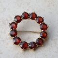 Garnet Twelve Stone Circular Brooch in 9ct Gold