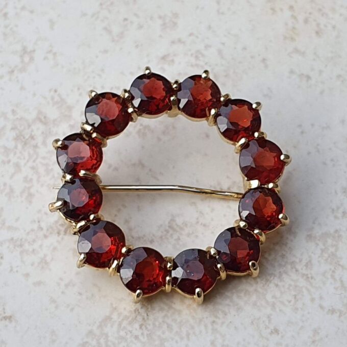 Garnet Twelve Stone Circular Brooch in 9ct Gold