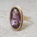 Elongated Oval Amethyst Solitaire Ring in 9ct gold.