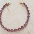 Amethyst Tennis Bracelet in 9ct Gold,  7 1/4 inches in length.