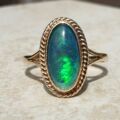 Oval Opal Doublet Ring in 9ct gold, a UK O or a US 7 1/2