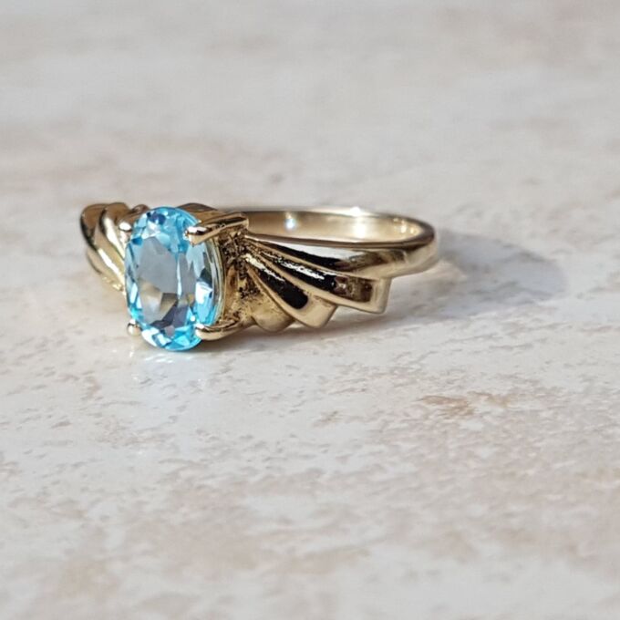Oval Sky Blue Topaz Solitaire Ring in 9ct Gold, a UK J or a US 5.