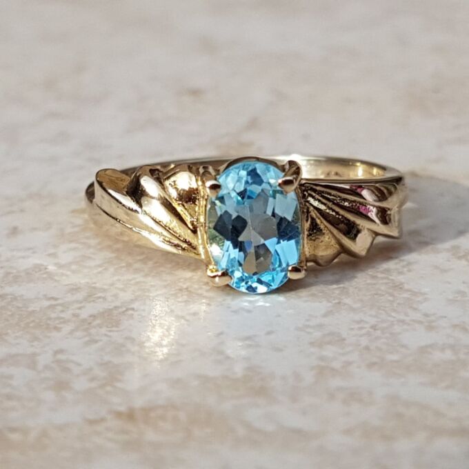 Oval Sky Blue Topaz Solitaire Ring in 9ct Gold, a UK J or a US 5.