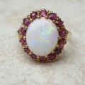 Opal & Ruby Ring in 9ct Gold, a UK O or a US 7 1/2