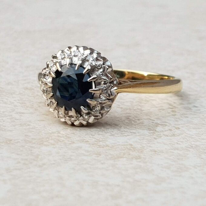 Sapphire and Diamond Halo ring in 18ct Gold and Platinum, a UK M or a US 6 1/2.