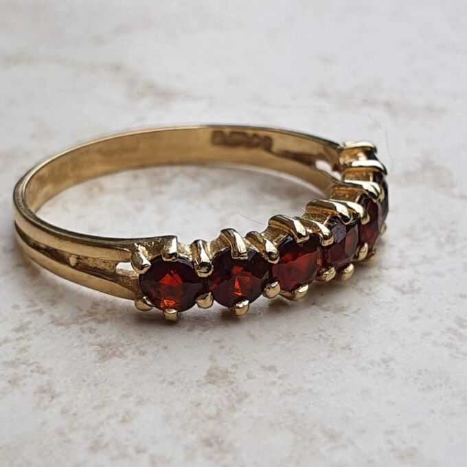 Seven Stone Garnet Band in 9ct Gold, a UK L 1/2 or a US 6