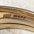 Four piece Puzzle Ring in 9ct Gold,  a UK P 1/2 or a US 8.