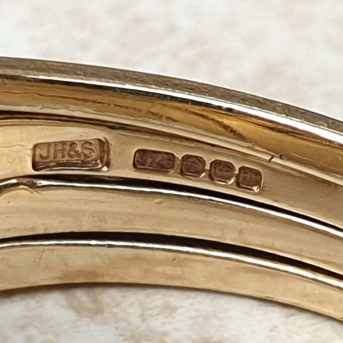 Four piece Puzzle Ring in 9ct Gold,  a UK P 1/2 or a US 8.