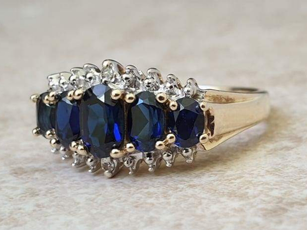 Graduating Synthetic Sapphire Five Stone Ring in 10k Gold.