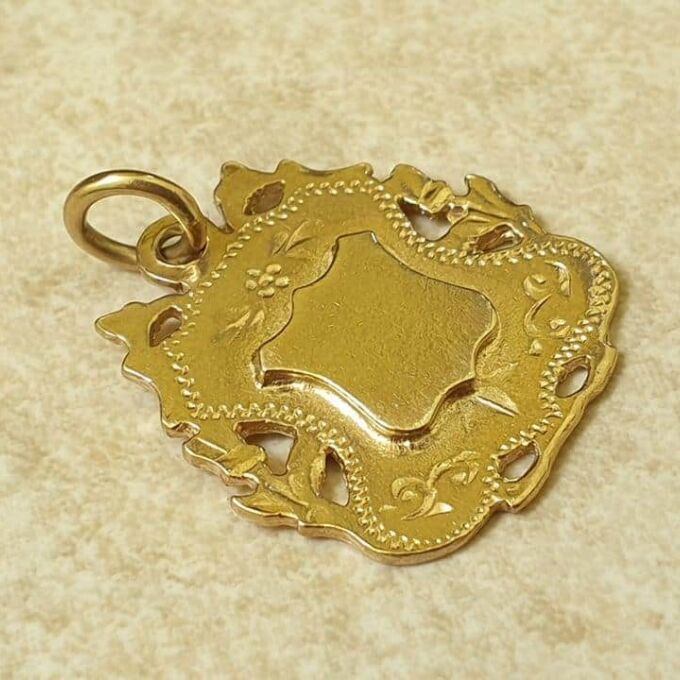 Ornate Shield Medallion in 9ct Gold. - Gems Afire - Vintage Jewellery UK