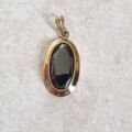 Oval Hematite Pendant in 9ct Gold.