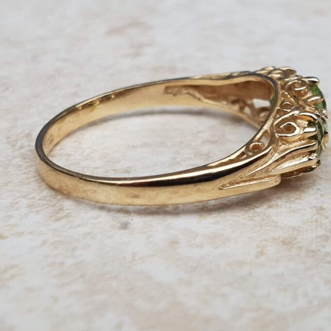 Summery Peridot Three Stone Ring in 9ct Gold, a UK N 1/2 or a US 7 1/4.