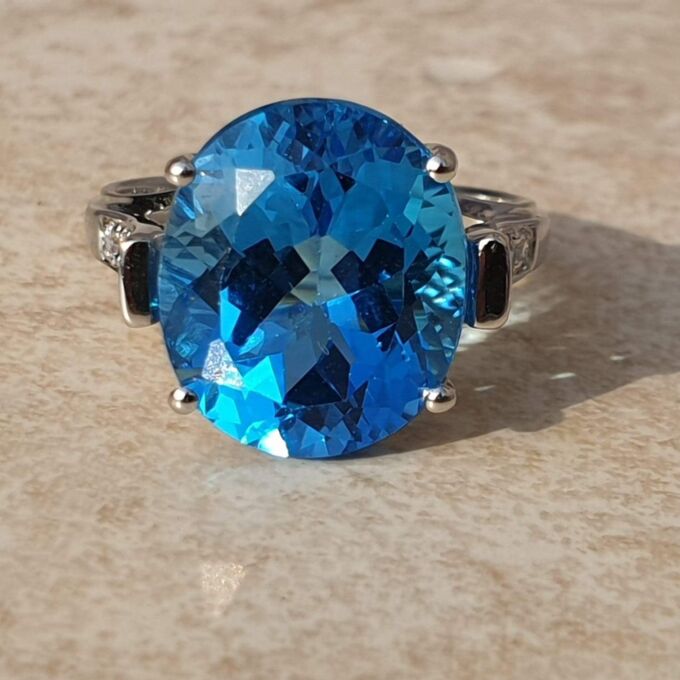 Swiss Blue Topaz Solitaire Ring in 9ct White Gold,  a UK N 1/2 or a US 7 1/4.