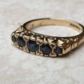 Blue Sapphire Five Stone Ring in 9ct Yellow Gold, a UK K 1/2 or a US 5 3/4.