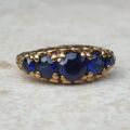 Vibrant Blue Five Stone Synthetic Sapphire Ring in 9ct Gold, a UK N or a US 7.