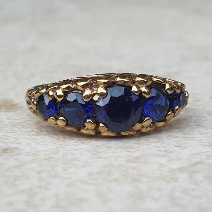 Vibrant Blue Five Stone Synthetic Sapphire Ring in 9ct Gold, a UK N or a US 7.