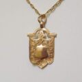Shield Medallion in 9ct Gold.