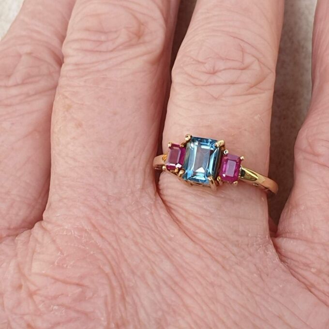 Topaz and Synthetic Ruby Trilogy Ring in 9ct Gold.