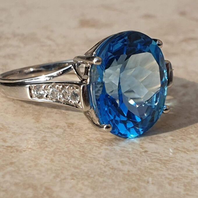 Swiss Blue Topaz Solitaire Ring in 9ct White Gold,  a UK N 1/2 or a US 7 1/4.