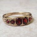Six Stone Graduating Garnet Band Ring in 9ct Gold, a UK S or a US 9 1/4