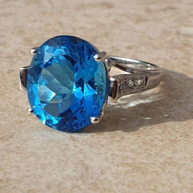 Swiss Blue Topaz Solitaire Ring in 9ct White Gold,  a UK N 1/2 or a US 7 1/4.