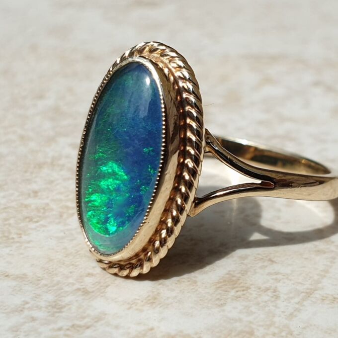 Oval Opal Doublet Ring in 9ct gold, a UK O or a US 7 1/2