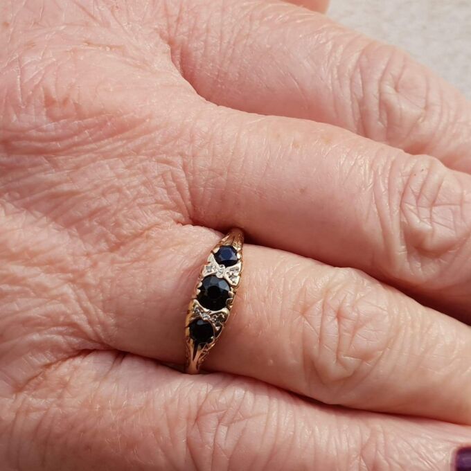 Three Stone Sapphire Ring with Diamonds in 9ct Gold, a UK O 1/2 or a US 7 1/2.
