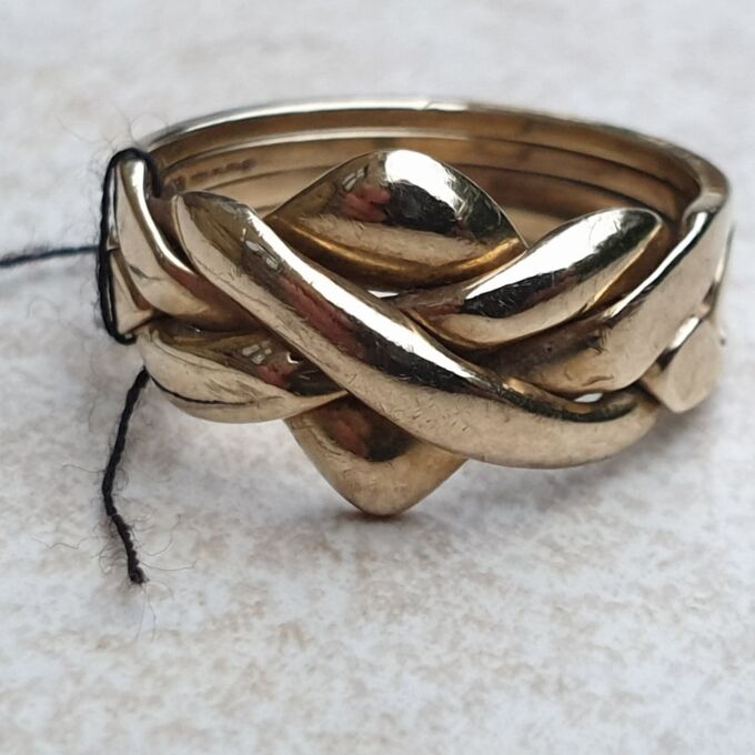 Four Piece Puzzle Ring in 9ct Gold, a UK N 1/2 or a US 7 1/2