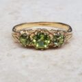 Summery Peridot Three Stone Ring in 9ct Gold, a UK N 1/2 or a US 7 1/4.