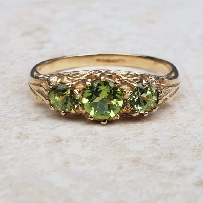 Summery Peridot Three Stone Ring in 9ct Gold, a UK N 1/2 or a US 7 1/4.
