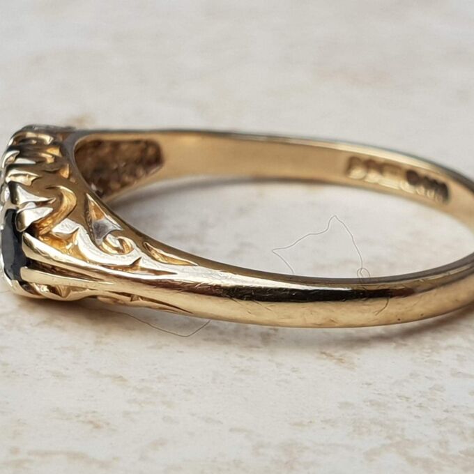 Three Stone Sapphire Ring with Diamonds in 9ct Gold, a UK O 1/2 or a US 7 1/2.