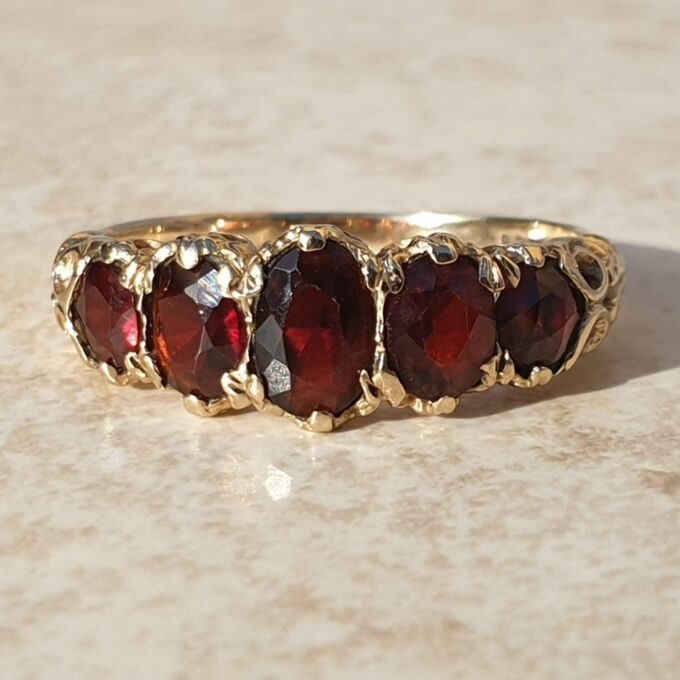 Graduating Five Stone Garnet Ring in 9ct Gold,  a UK N 1/2 or a US almost 7 1/4.