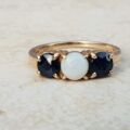 Opal and Sapphire Trilogy Ring in 9ct Gold, a UK J 1/2 or a US 5 1/4.