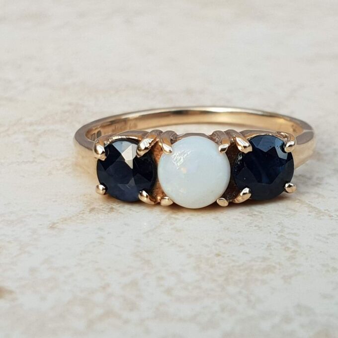 Opal and Sapphire Trilogy Ring in 9ct Gold, a UK J 1/2 or a US 5 1/4.