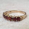 Seven Stone Garnet Band in 9ct Gold, a UK L 1/2 or a US 6