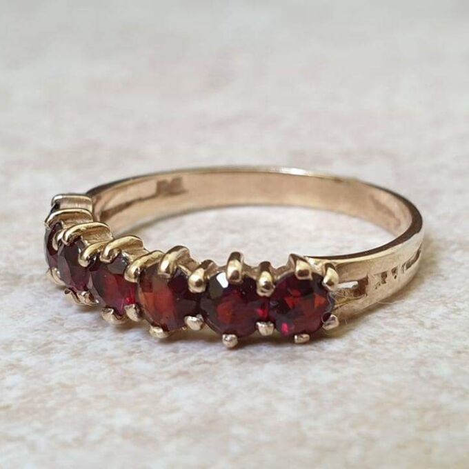 Seven Stone Garnet Band in 9ct Gold, a UK L 1/2 or a US 6