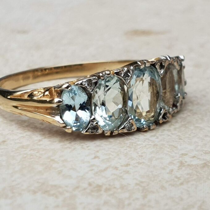 Beautiful Five Stone Aquamarine Ring in 9ct Gold, a UK O or a US 7 1/2.