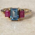 Topaz and Synthetic Ruby Trilogy Ring in 9ct Gold.