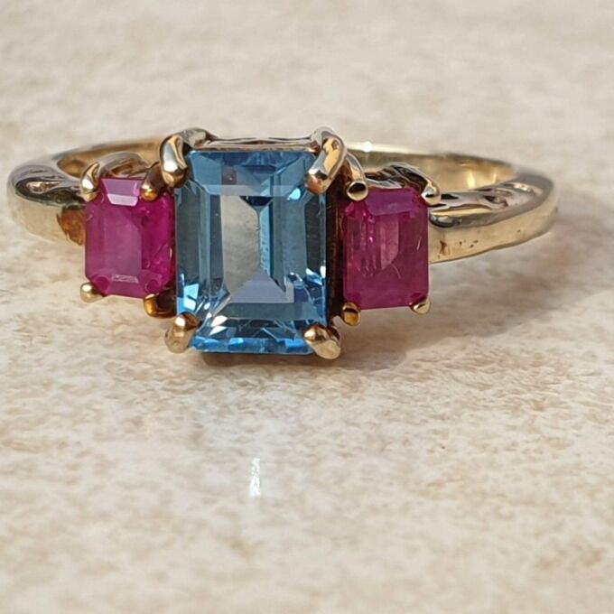 Topaz and Synthetic Ruby Trilogy Ring in 9ct Gold.