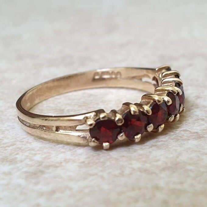 Seven Stone Garnet Band in 9ct Gold, a UK L 1/2 or a US 6