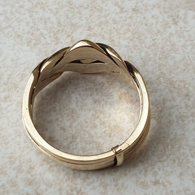 Four piece Puzzle Ring in 9ct Gold,  a UK P 1/2 or a US 8.